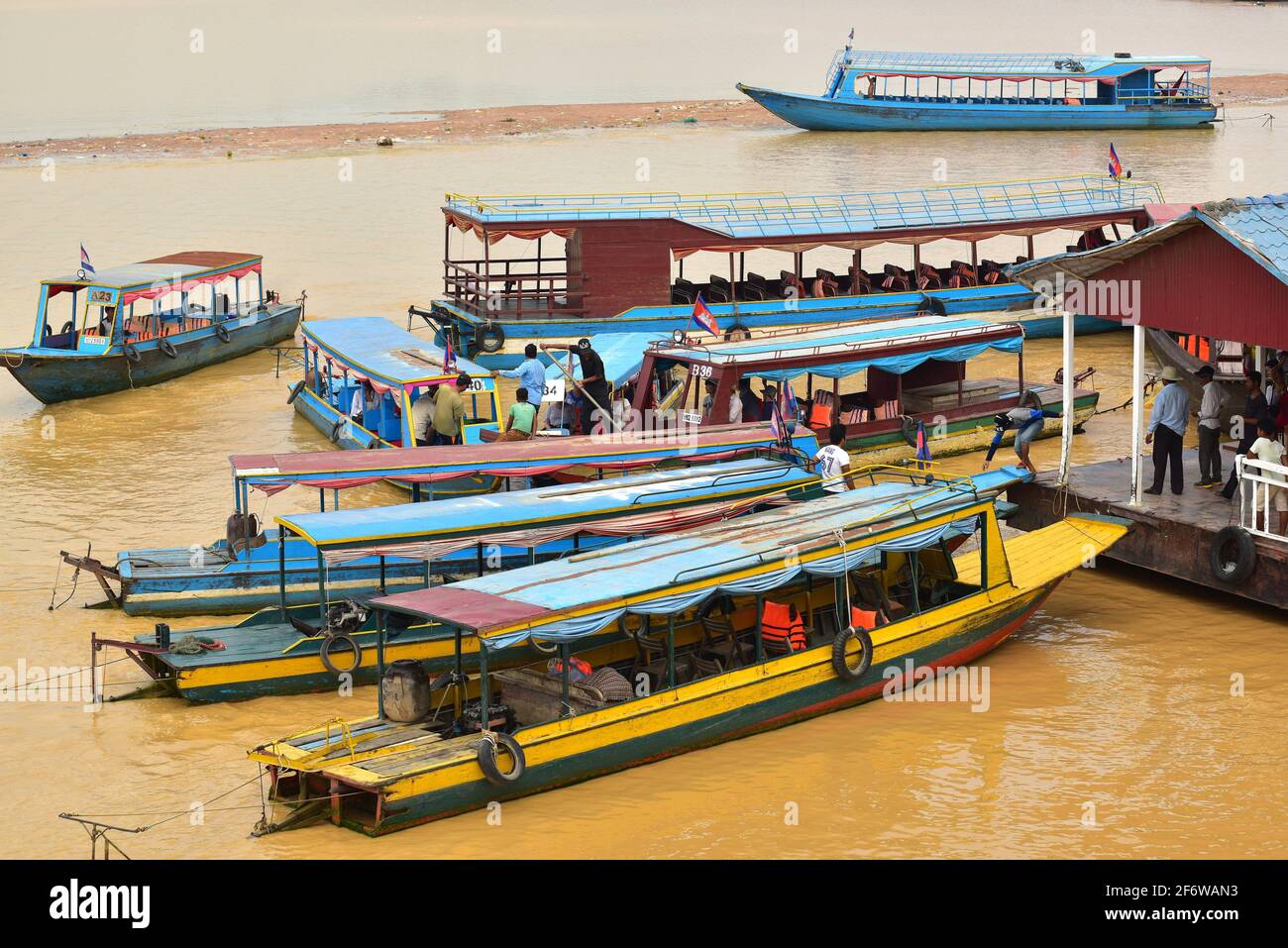Pleasure motor boats pier to go to Tonle Sap. Siem Reap, Cambodia. Stock Photo