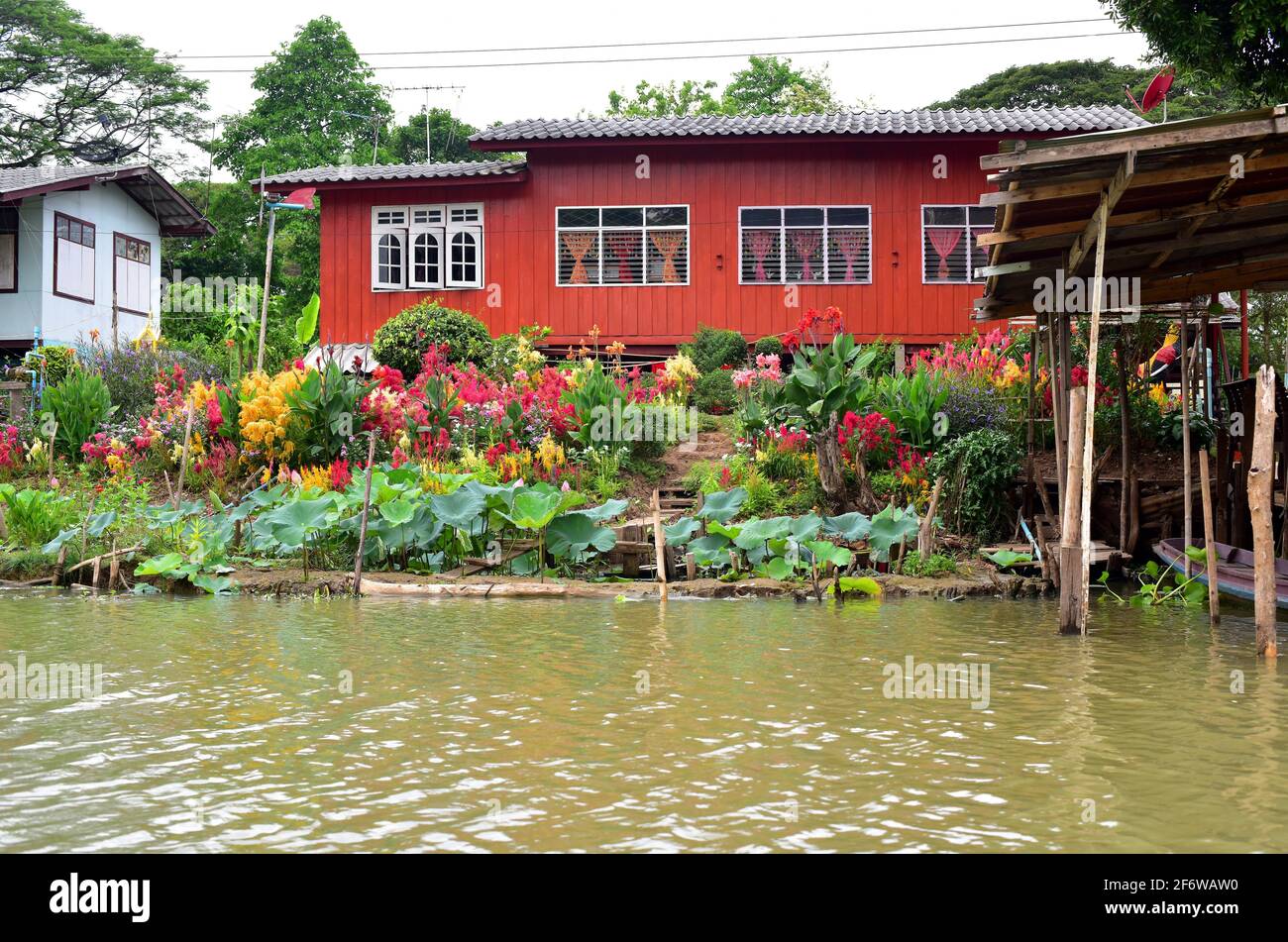 Ayutthaya, stilt houses on the Chao Phraya river bank. Phra Nakhon Si Ayutthaya, Thailand. Stock Photo