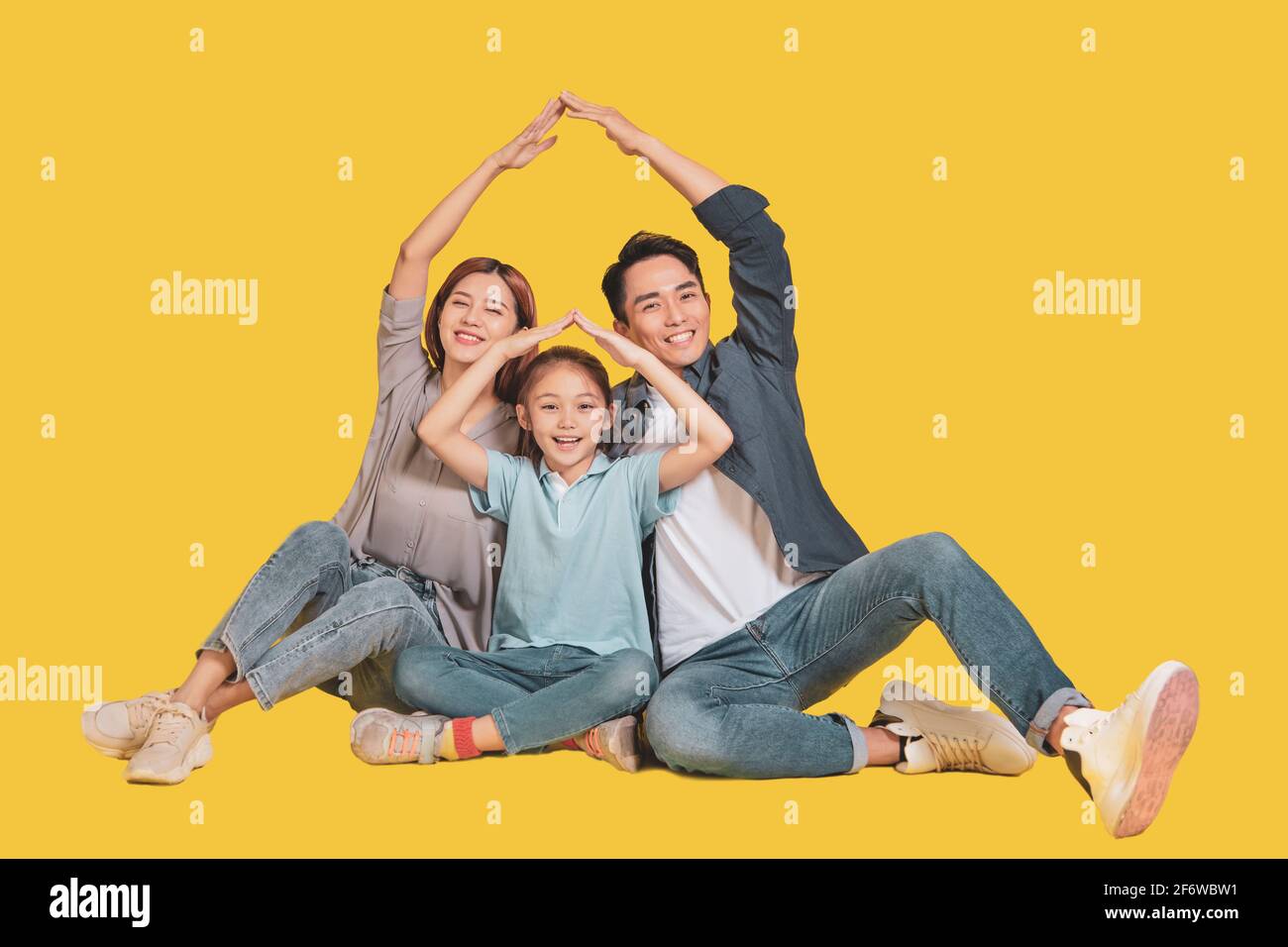 Happy young  family hands shaping home and house concepts Stock Photo