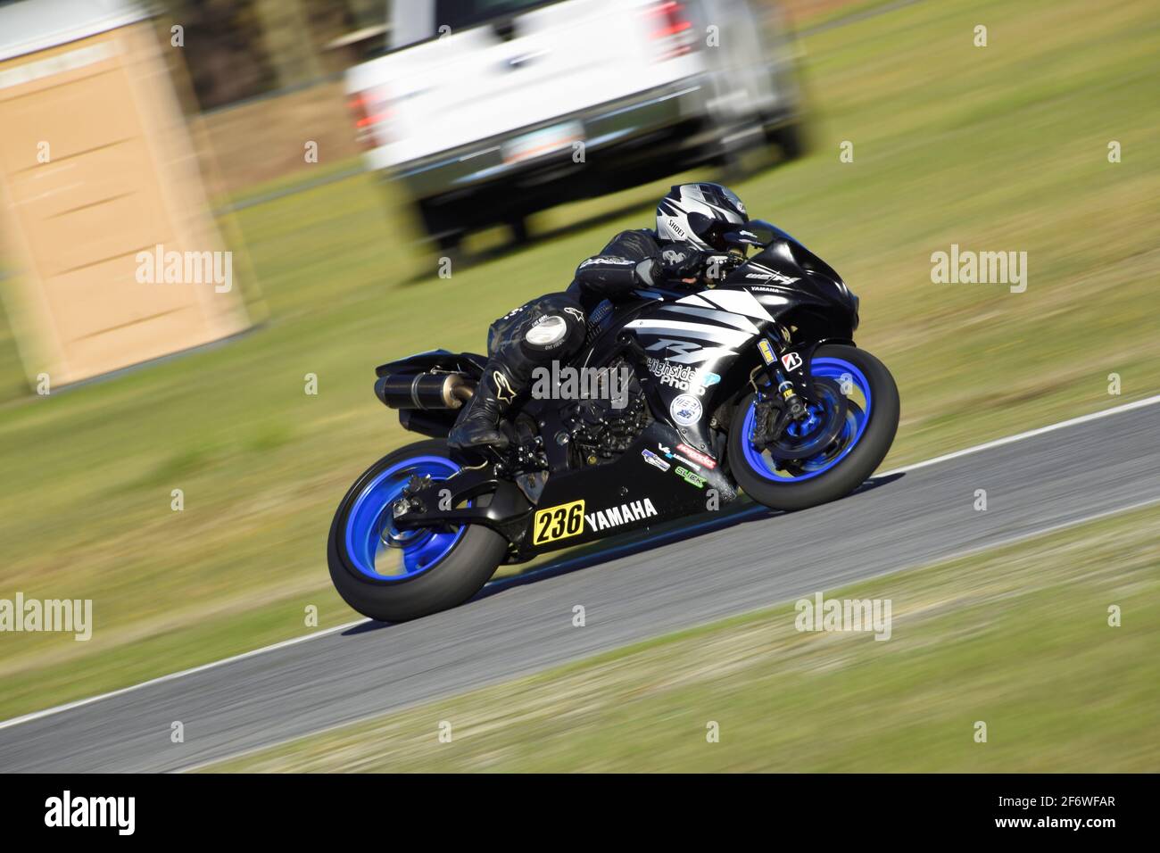 Yamaha R1 exits Turn 5 at Roebling Road Raceway during the Stickboy Racing track day in preparation for WERA Atlantic Coastal regional opener. Stock Photo
