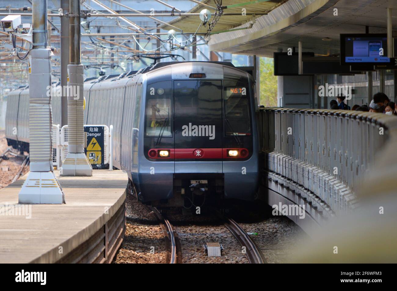 MTR Rotem EMU pulling into Sunny Bay MTR station (欣澳站), Lantau Island, Hong Kong Stock Photo