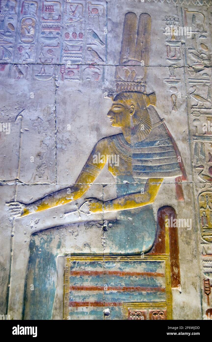 A painted ancient egyptian hieroglyphic carving of the goddess of