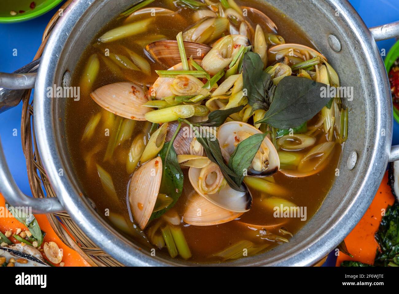 Bowl of spicy clams cooked with lemongrass, chili and tamarind  Stock Photo
