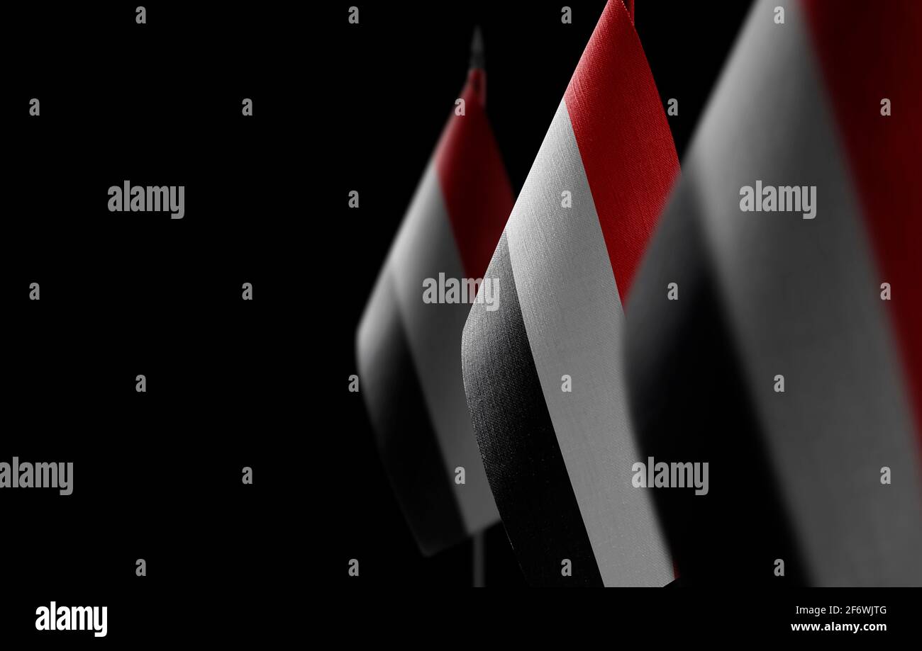 Small national flags of the Yemen on a black background Stock Photo