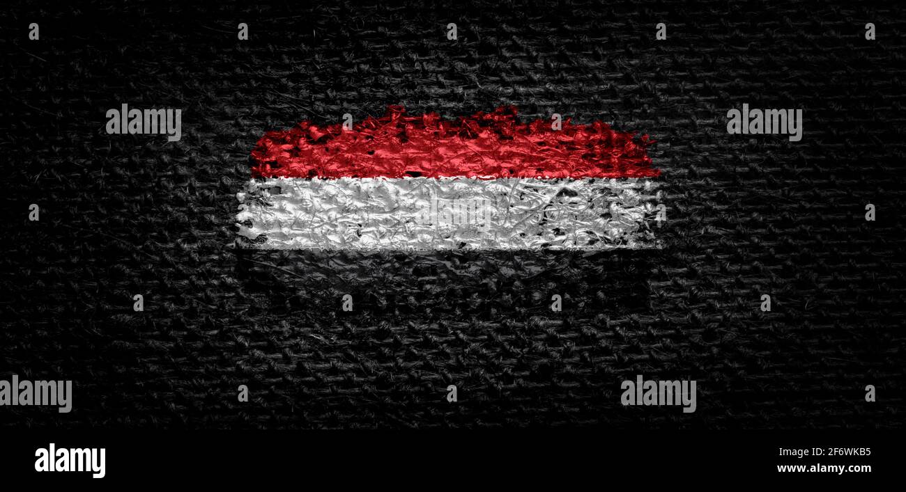 National flag of the Yemen on dark fabric Stock Photo