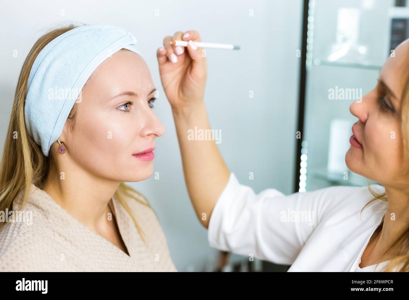 Skin care and facelift. A young woman at a beauticians appointment. A