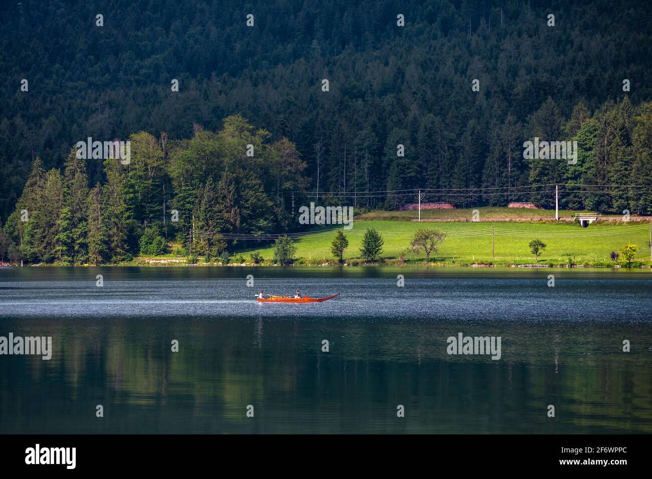 Tourists on a boat trip around lake Hallstätter See or Lake Hallstatt in Gosaumühle, Austria Stock Photo