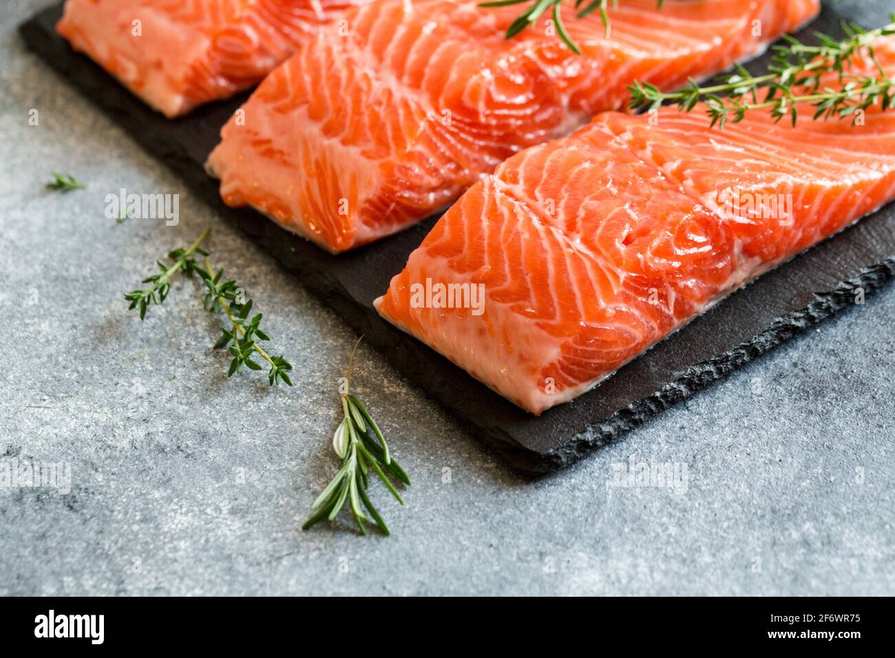 salmon-fresh-raw-salmon-fish-fillet-with-cooking-ingredients-herbs