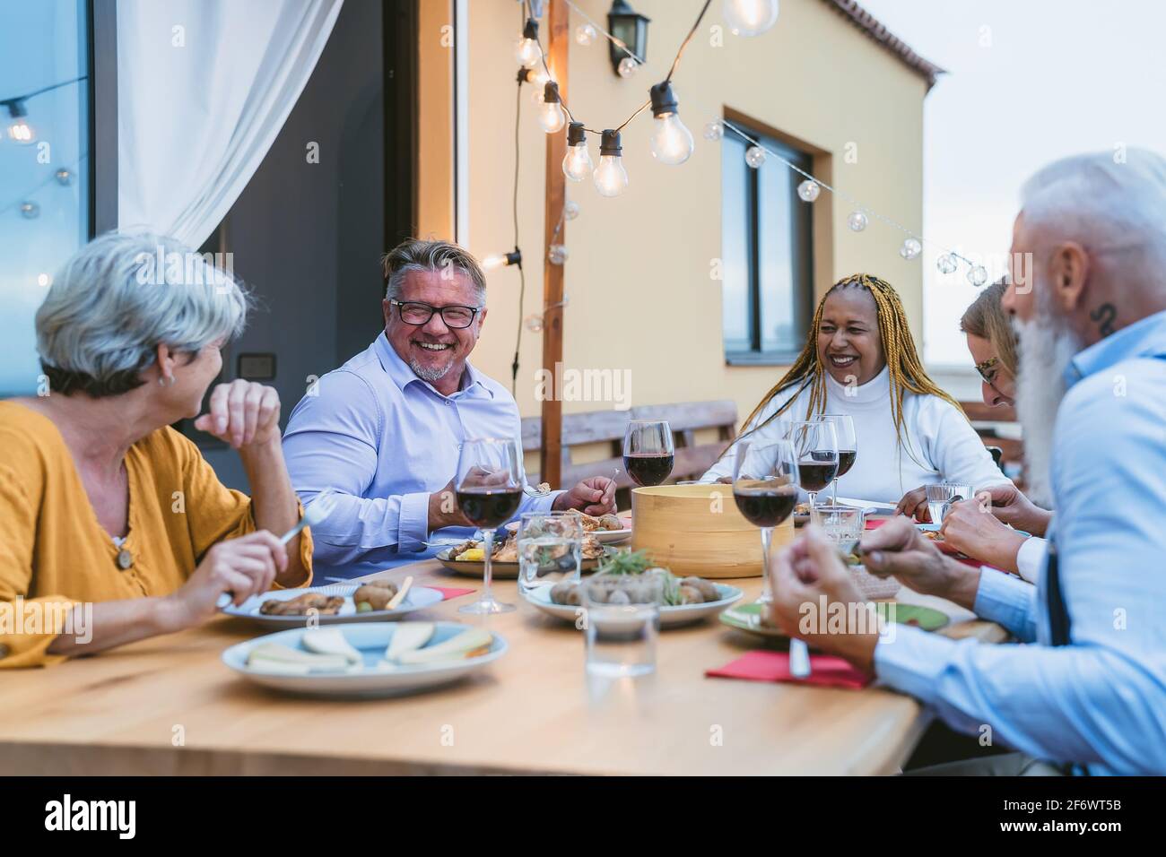 Multiracial group older people smiling hi-res stock photography and ...