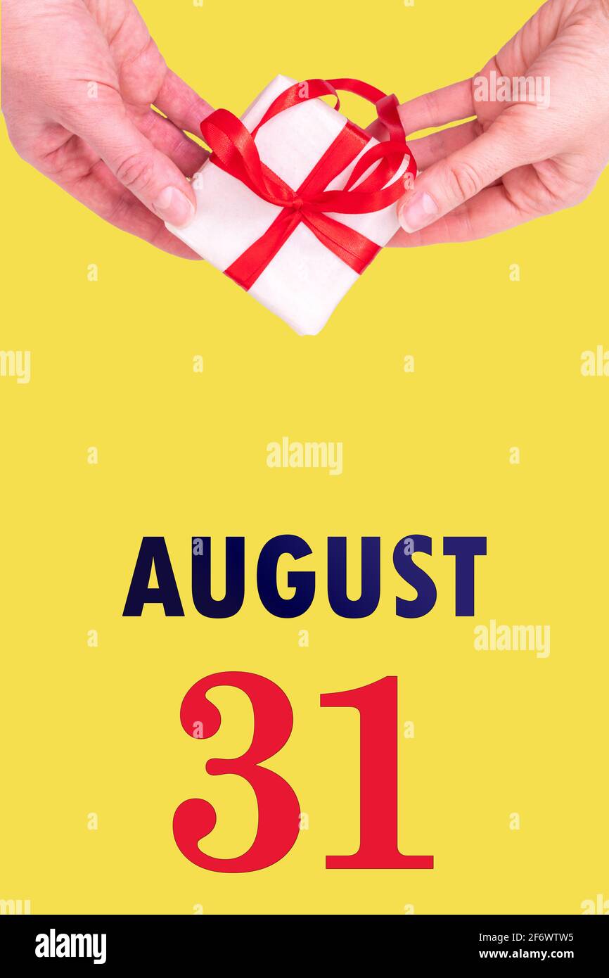 August 31st. Festive Vertical Calendar With Hands Holding White Gift