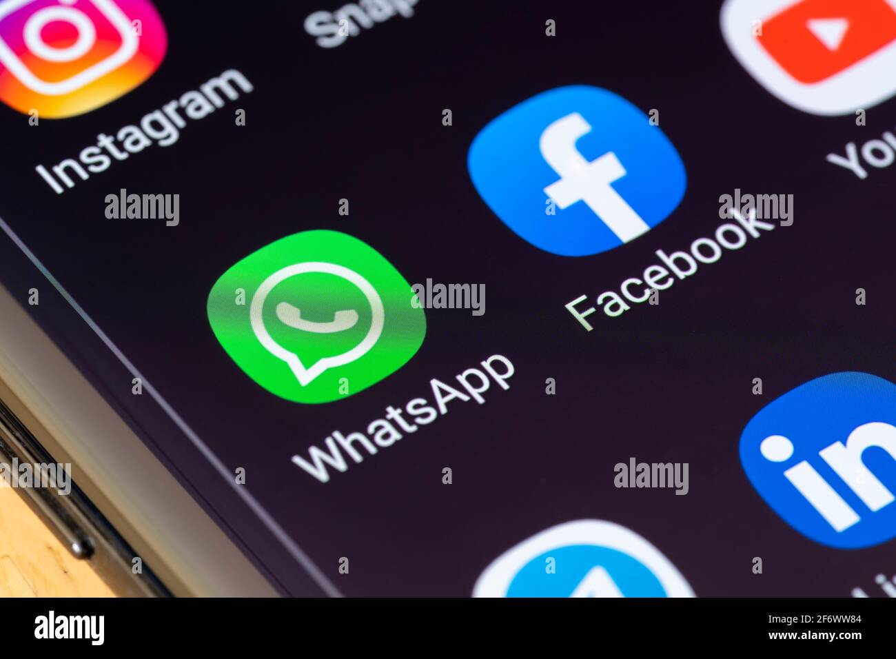 WhatsApp app on a smartphone. WhatsApp is an American freeware, cross-platform centralized messaging and voice-over-IP service owned by Facebook Inc Stock Photo