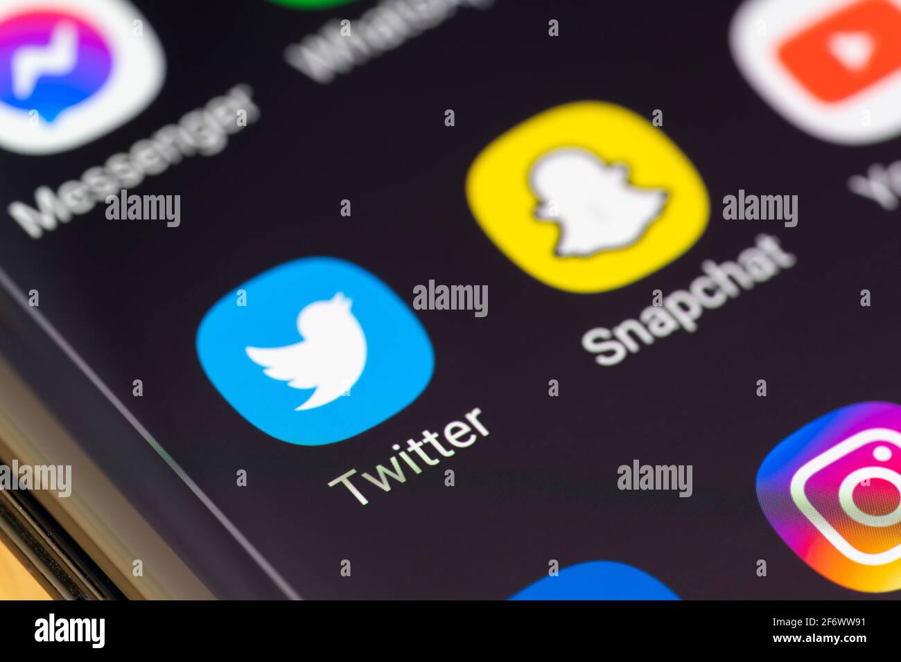 A macro closeup of the Twitter app on a smartphone screen. Twitter is an American microblogging and social networking service Stock Photo