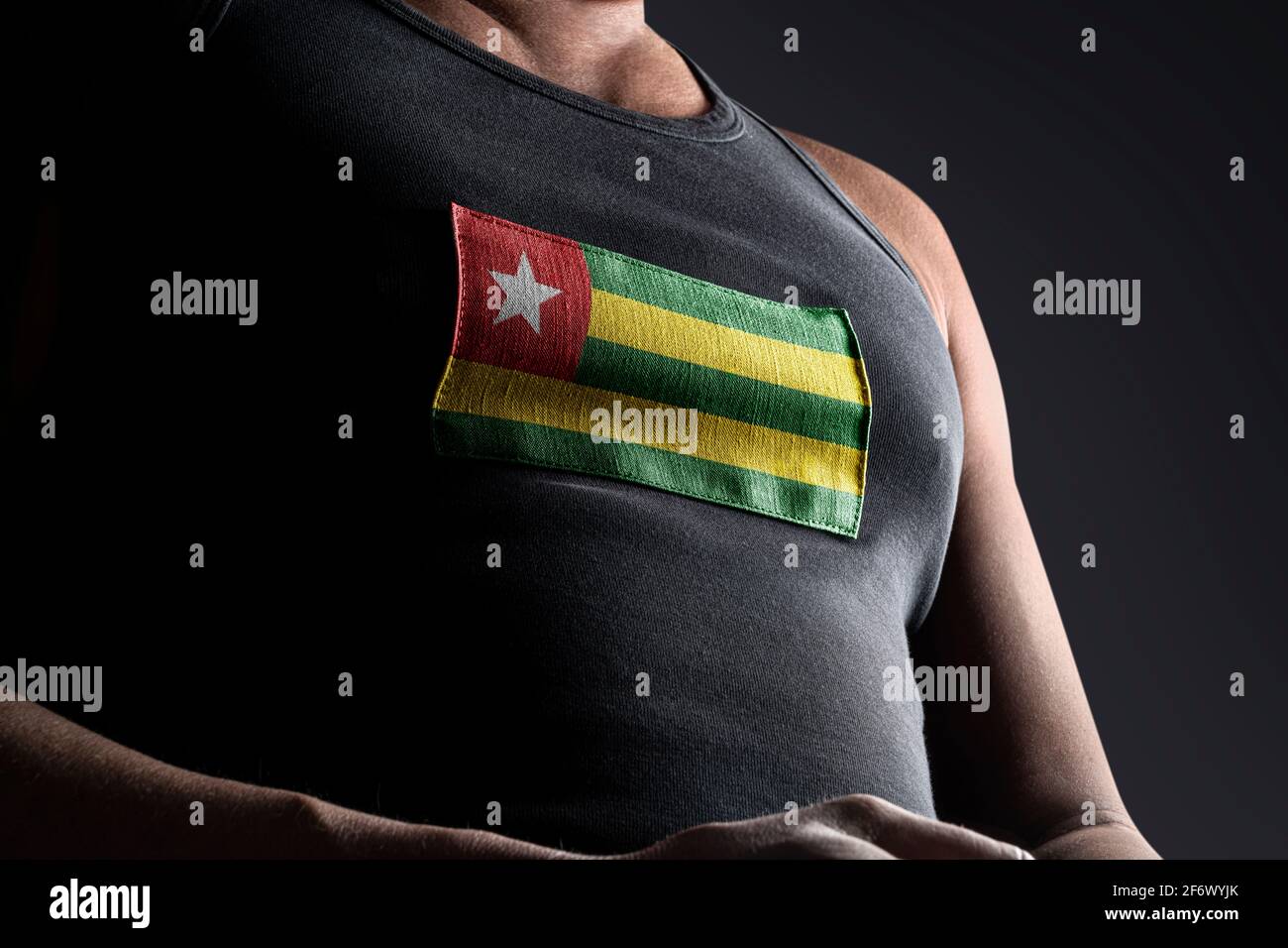 The national flag of Togo on the athlete's chest Stock Photo