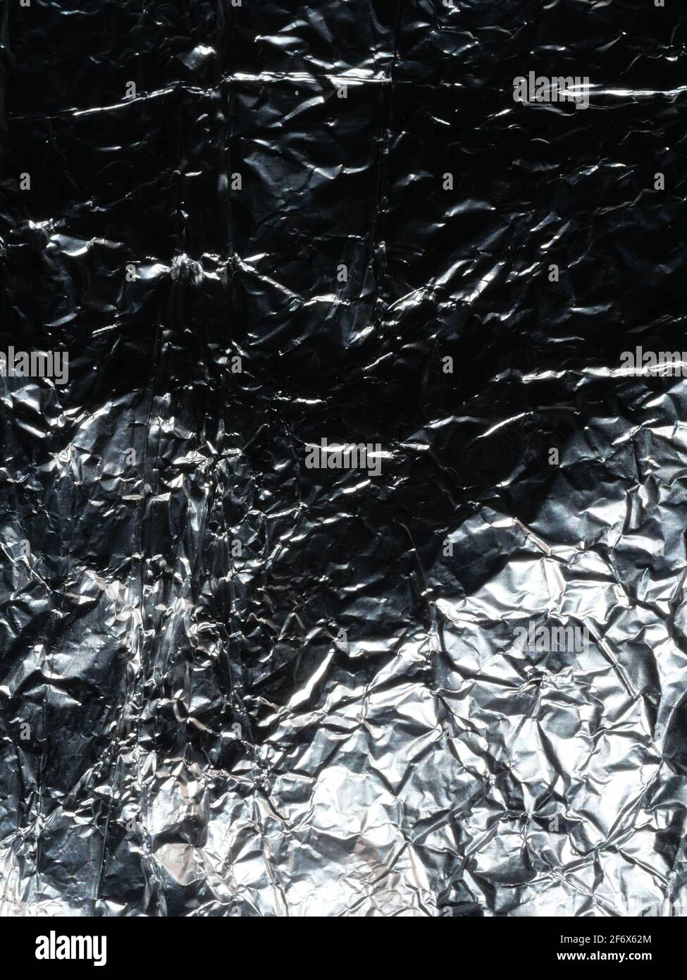 Thin sheet of silver leaf background with shiny uneven surface Stock Photo  - Alamy, image size:975x1390