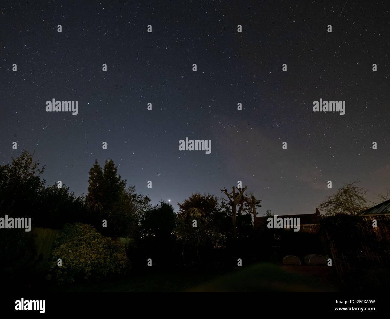 Starry Sky with the planet Venus Setting and The Pleiades just above. Stock Photo
