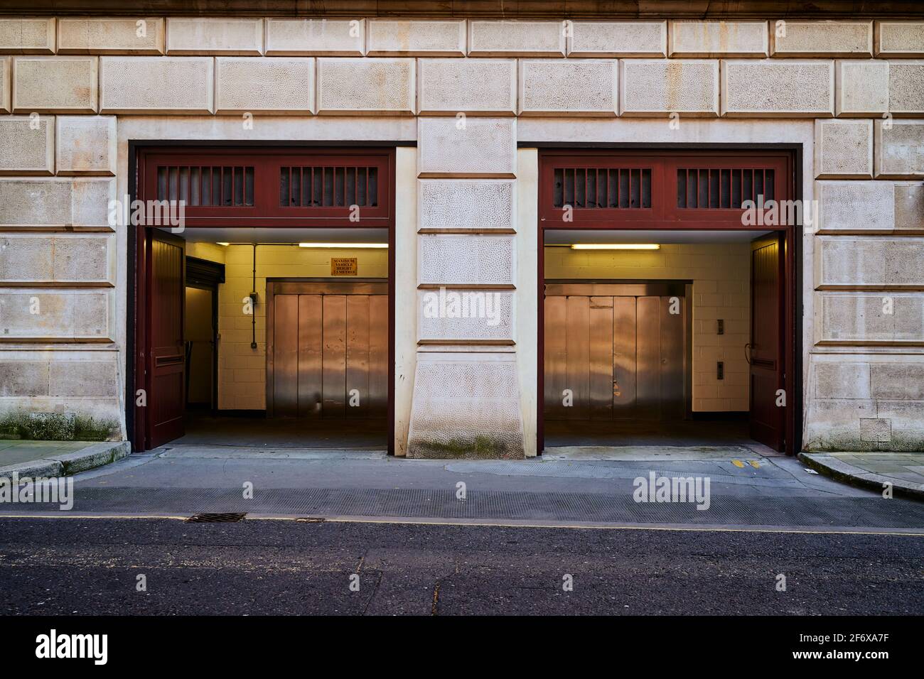 London, UK - 2 April 2021 : two building car entrance with garage lift a elevator doorway Stock Photo