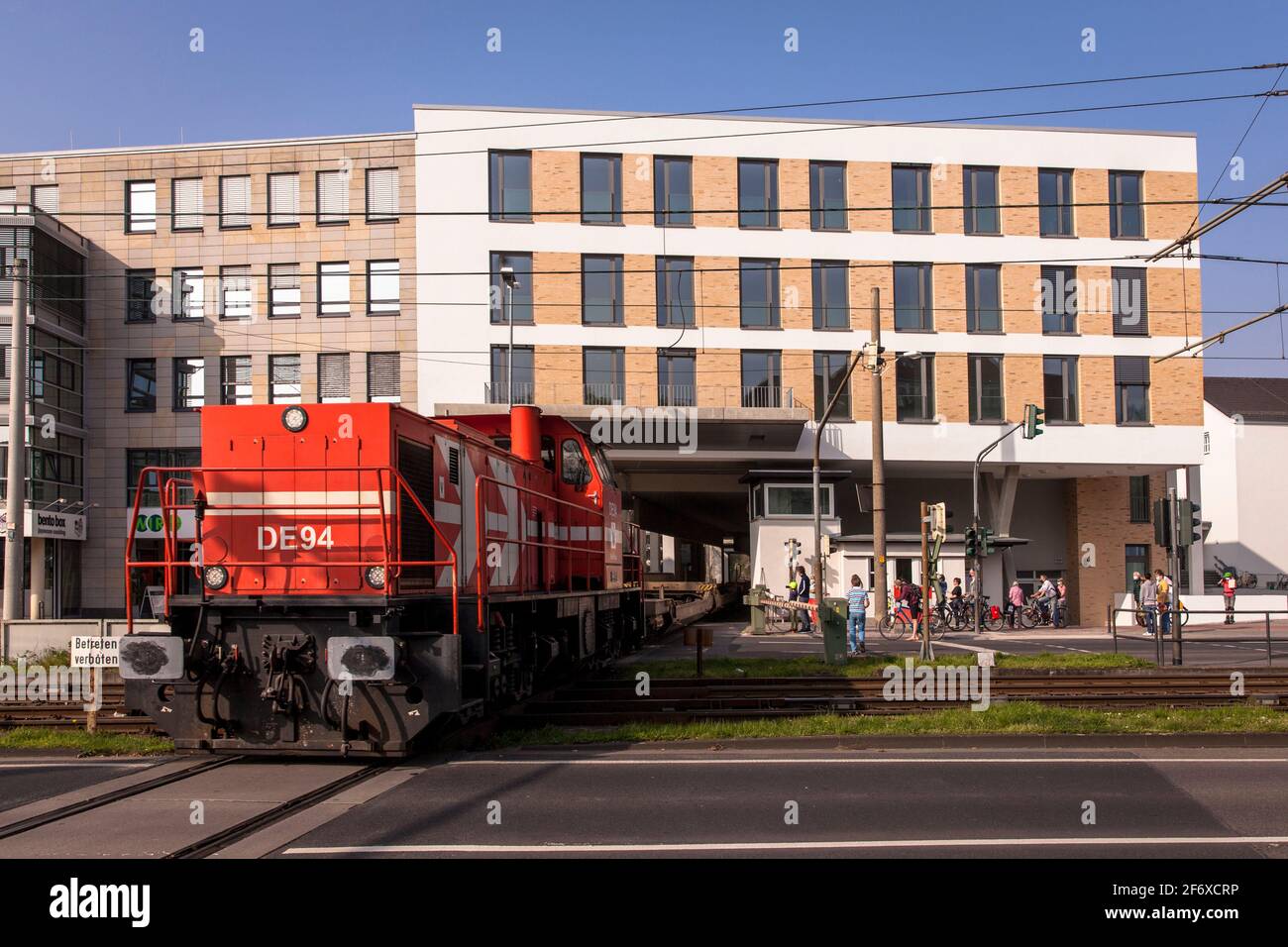 rail line built over with three residential buildings at Clarenbachplatz in the Braunsfeld district of Cologne, Germany. Freight trains up to 700 mete Stock Photo