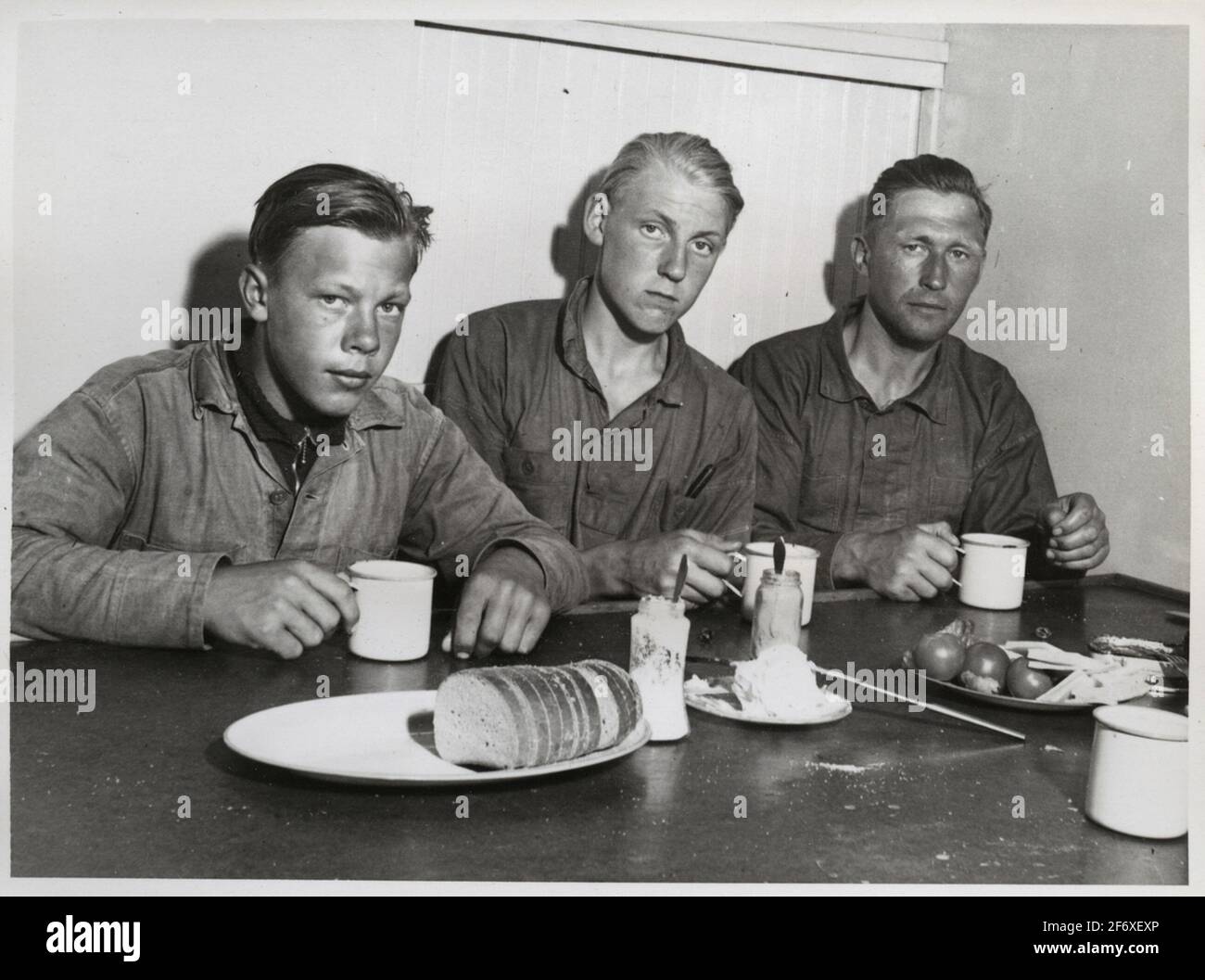 3 men at the breakfast table Stock Photo - Alamy