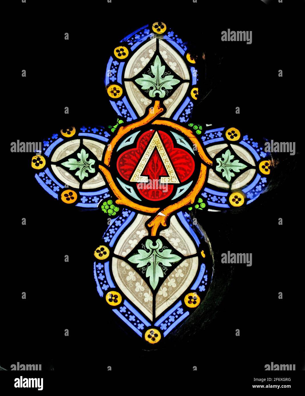 A stained glass window depicting the Alpha Symbol, St Nicholas Church, Fisherton Delamere, Wiltshire Stock Photo