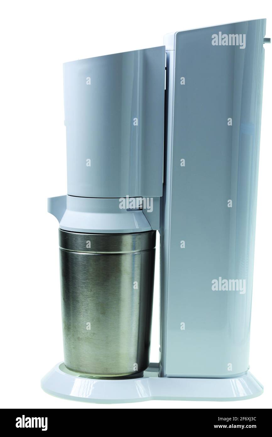 Close up view of sparkling water machine that bubbles water in glass ...