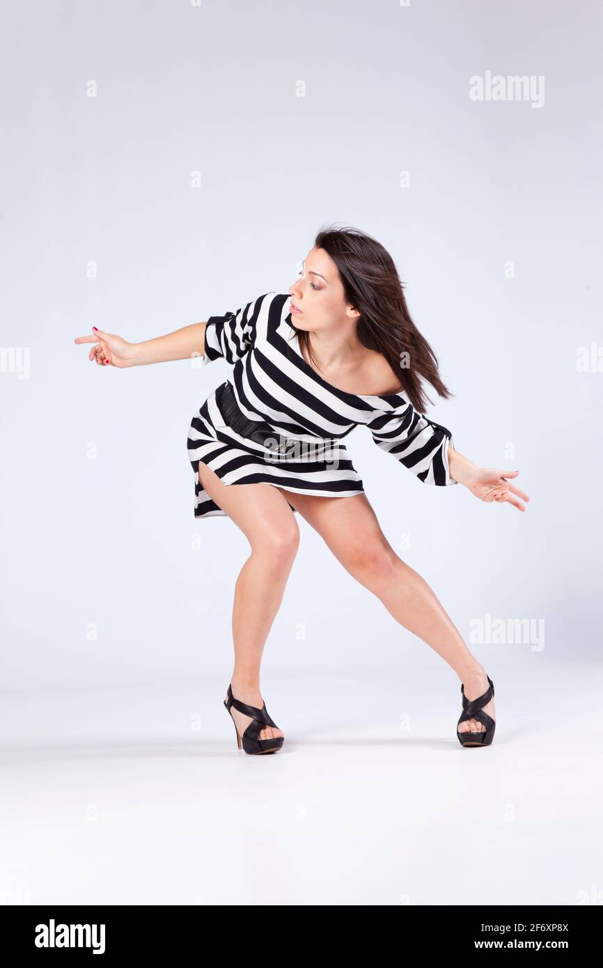 Vogue woman dancing isolated on gray Stock Photo