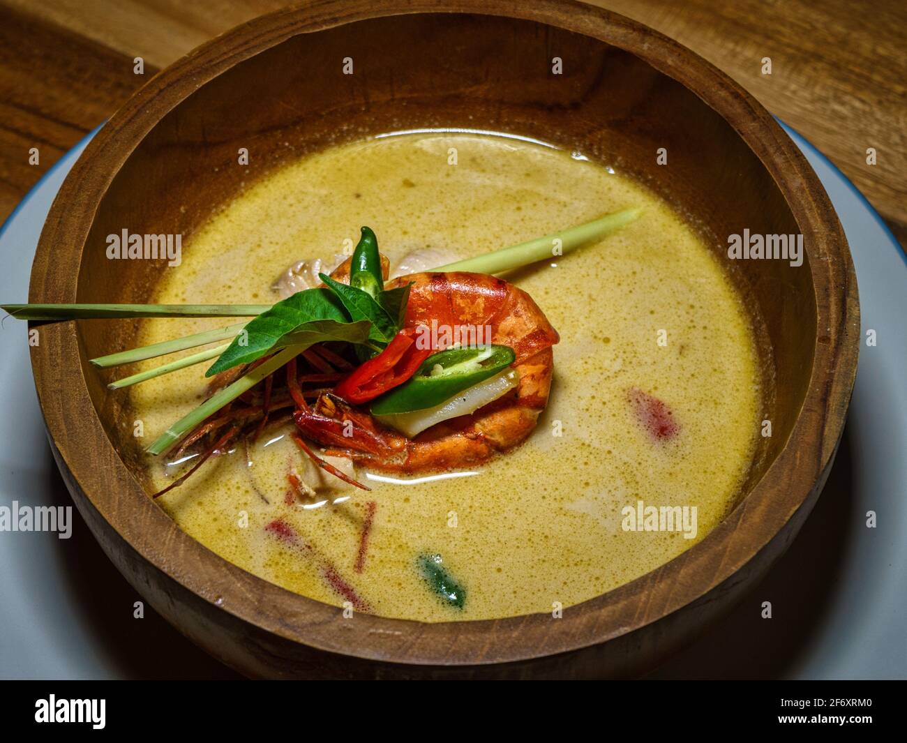 Close-up of a bowl of Curry soup with prawn Stock Photo