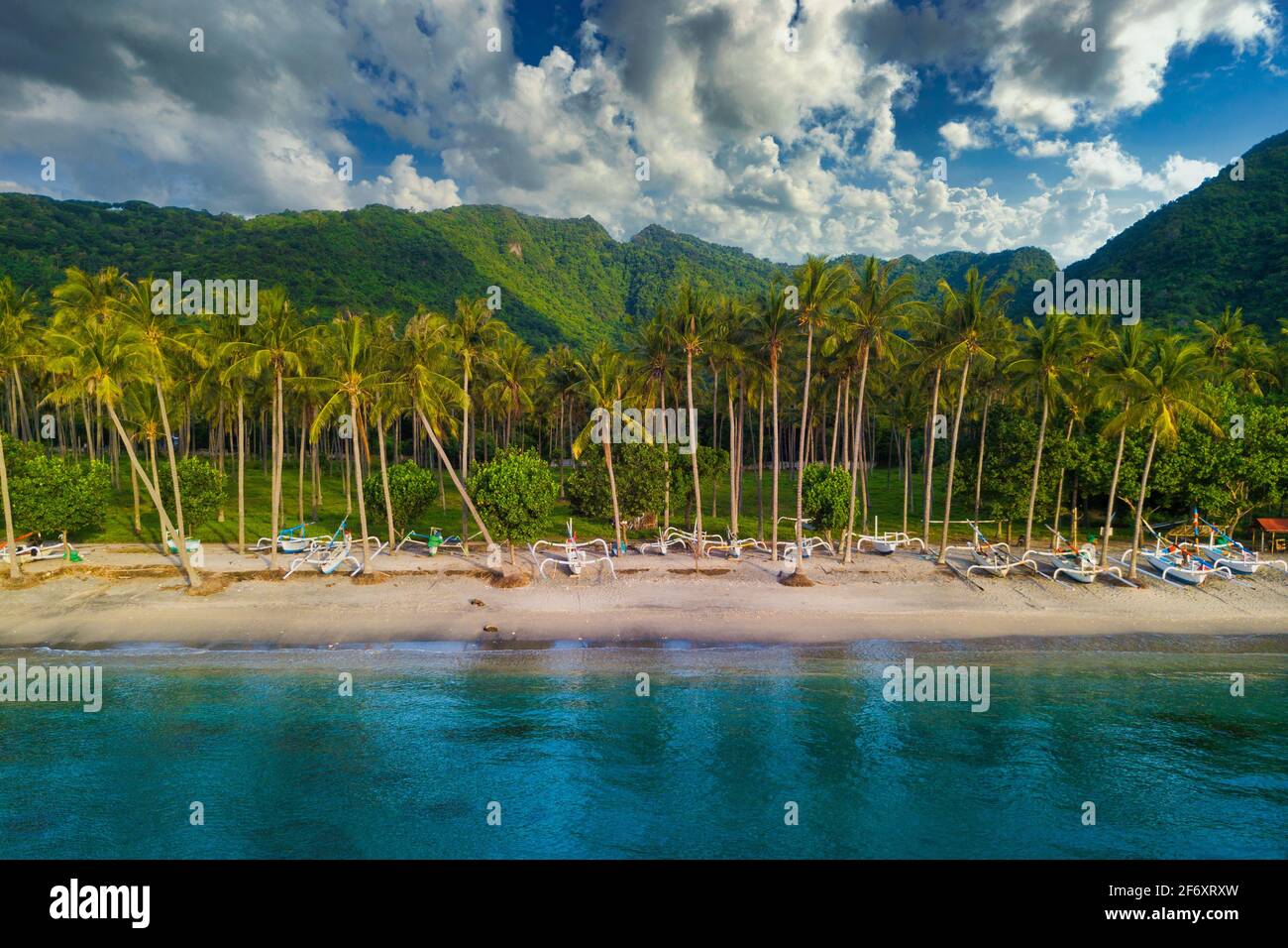 Aerial view of traditional jukung boats lined up on Senggigi beach, Lombok, West Nusa Tenggara, Indonesia Stock Photo