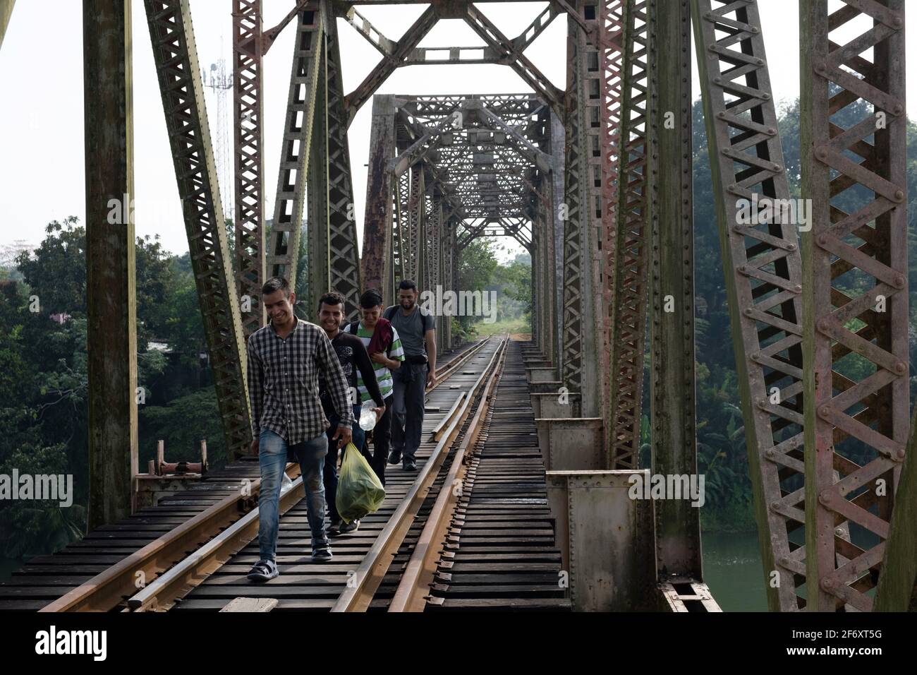 Huimanguillo, Mexico. 31st Mar, 2021. Hondurans Migrants, continue their journey on the railroad tracks, crossing Mezcalpa river in Tabasco to reach the U.S. border. looking for American dream. On March 31, 2021 Huimanguillo, Mexico. (Photo by Eyepix/Sipa USA) Credit: Sipa USA/Alamy Live News Stock Photo