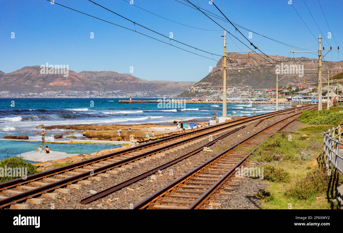 Cape Town, South Africa - March 23, 2021: Passenger rail running through small coastal town of St James Stock Photo