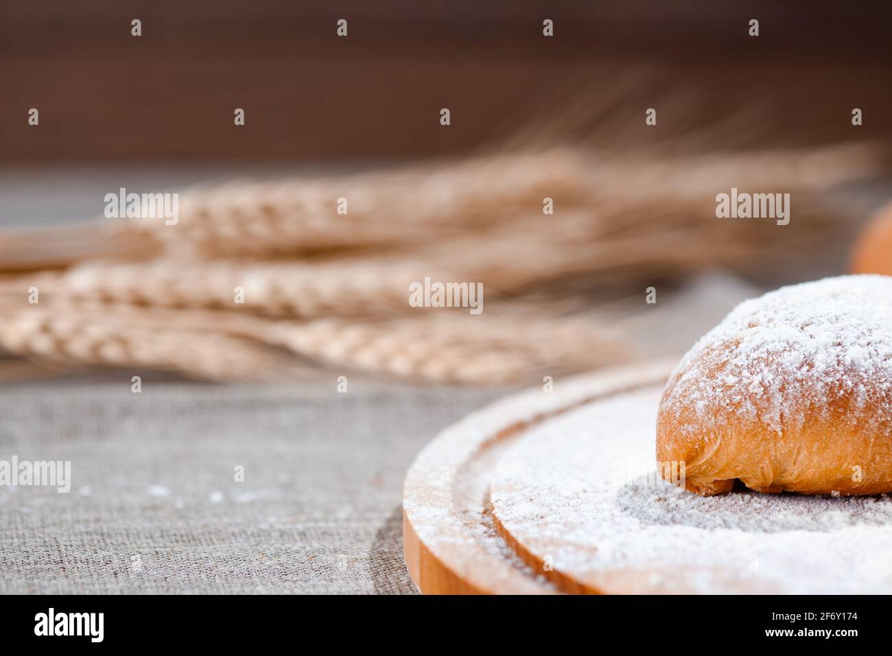 homemade pastries with pies and wheat ears Stock Photo