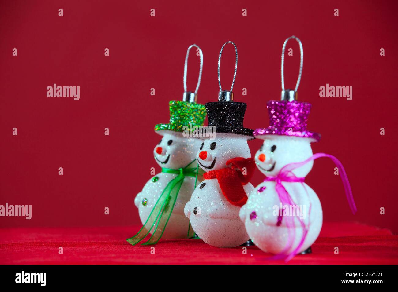 Snowman christmas decoration with red background (selective focus) Stock Photo