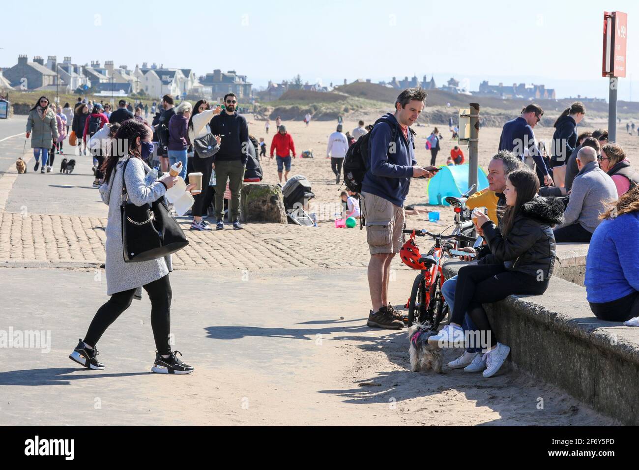 Troon, UK. 03rd Apr, 2021. On the first day of the easing of lockdown restrictions in Scotland, allowing people to 'travel locally' many took advantage of the sunny weather on Easter Saturday and enjoyed a day at the beach in Troon. Credit: Findlay/Alamy Live News Stock Photo
