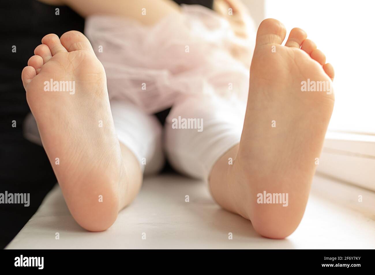 Close up of unrecognizablechild girl feet barefoot, photo Stock Photo