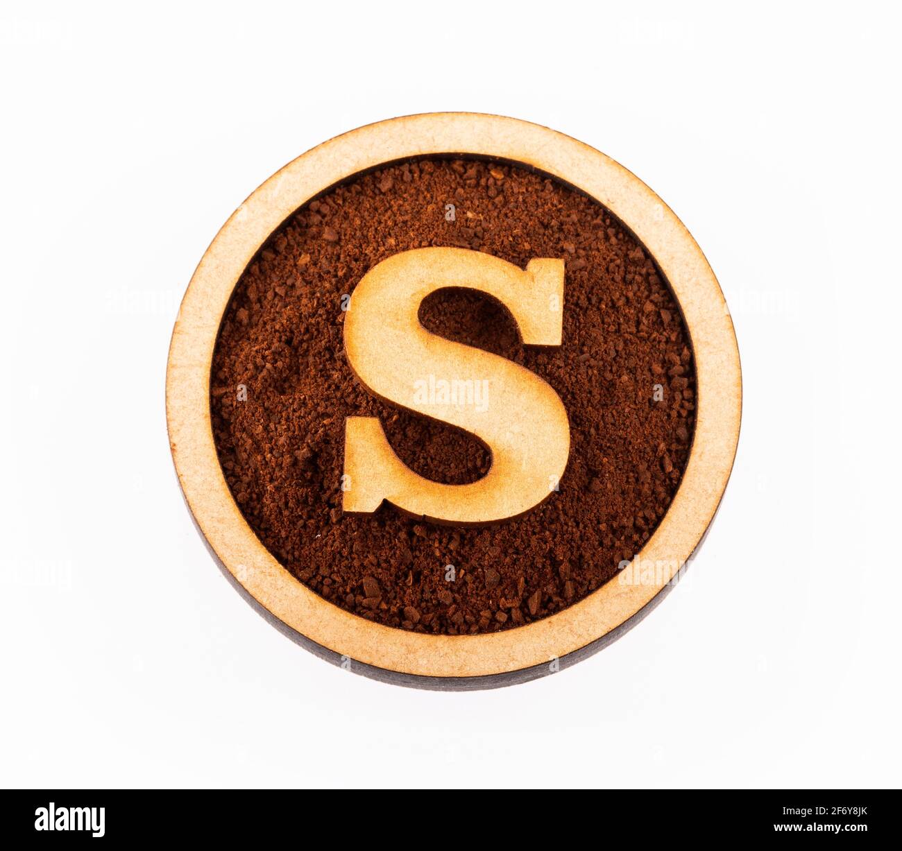 S, wooden alphabet letter - Ground organic coffee. Coffea Stock Photo