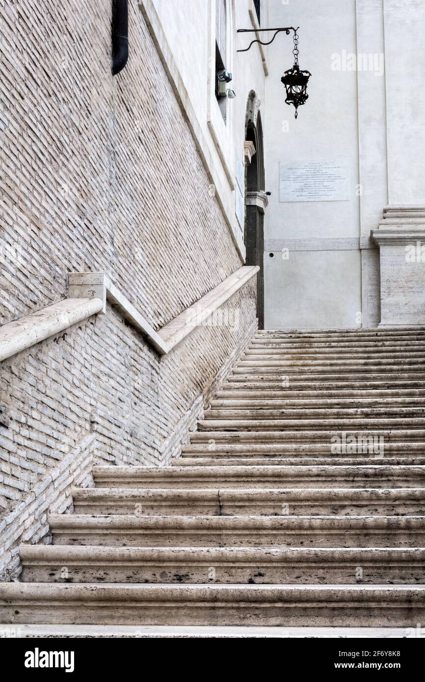 Rome, Italy - Oct 04, 2018: Marble staircase leading to the side entrance of the Santissima Trinità al Monte Pincio in Rome Stock Photo