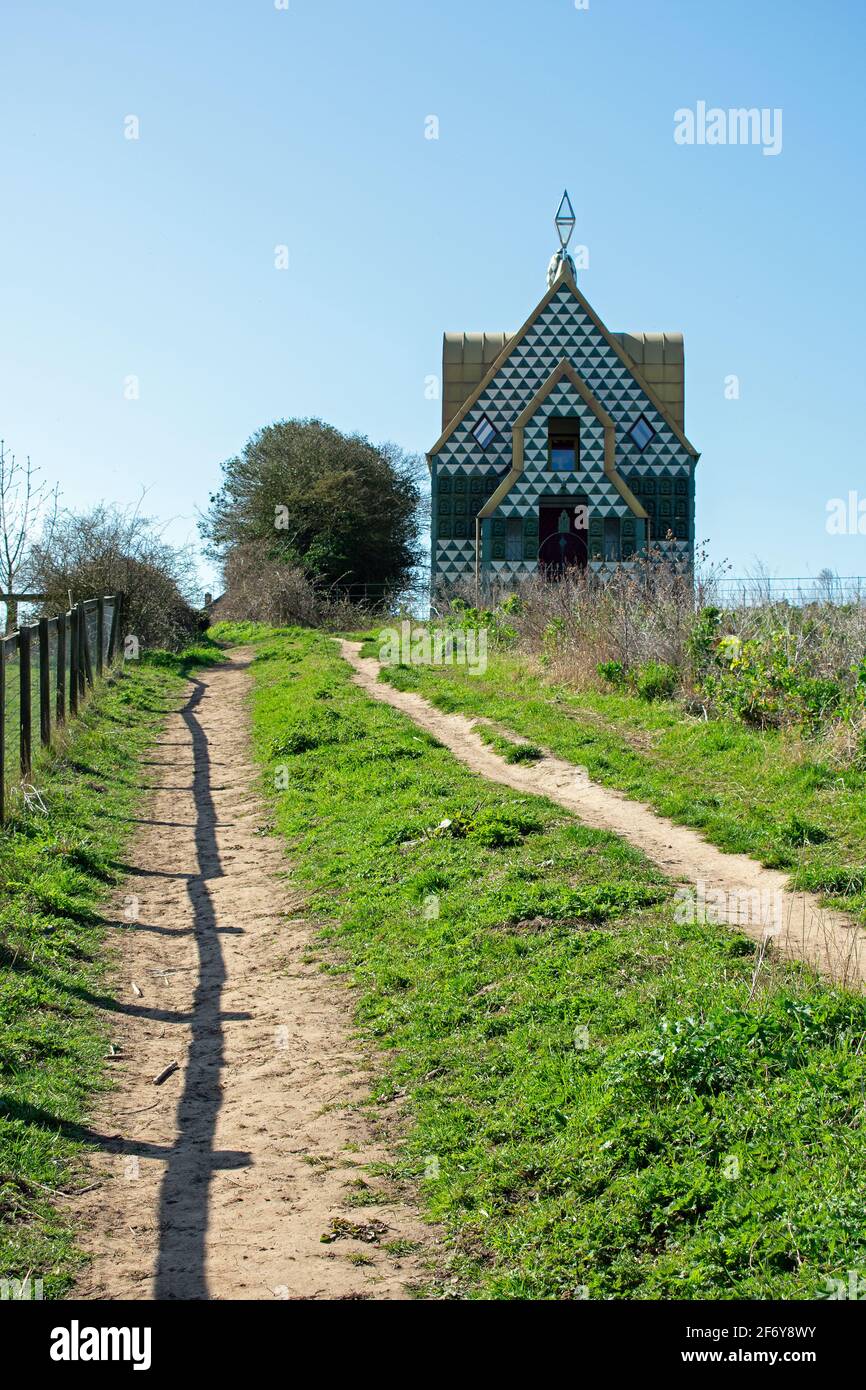A House For Essex by Grayson Perry in Wrabness, Essex, UK.  A footpath leads uphill towards the holiday rental through the countryside. Stock Photo