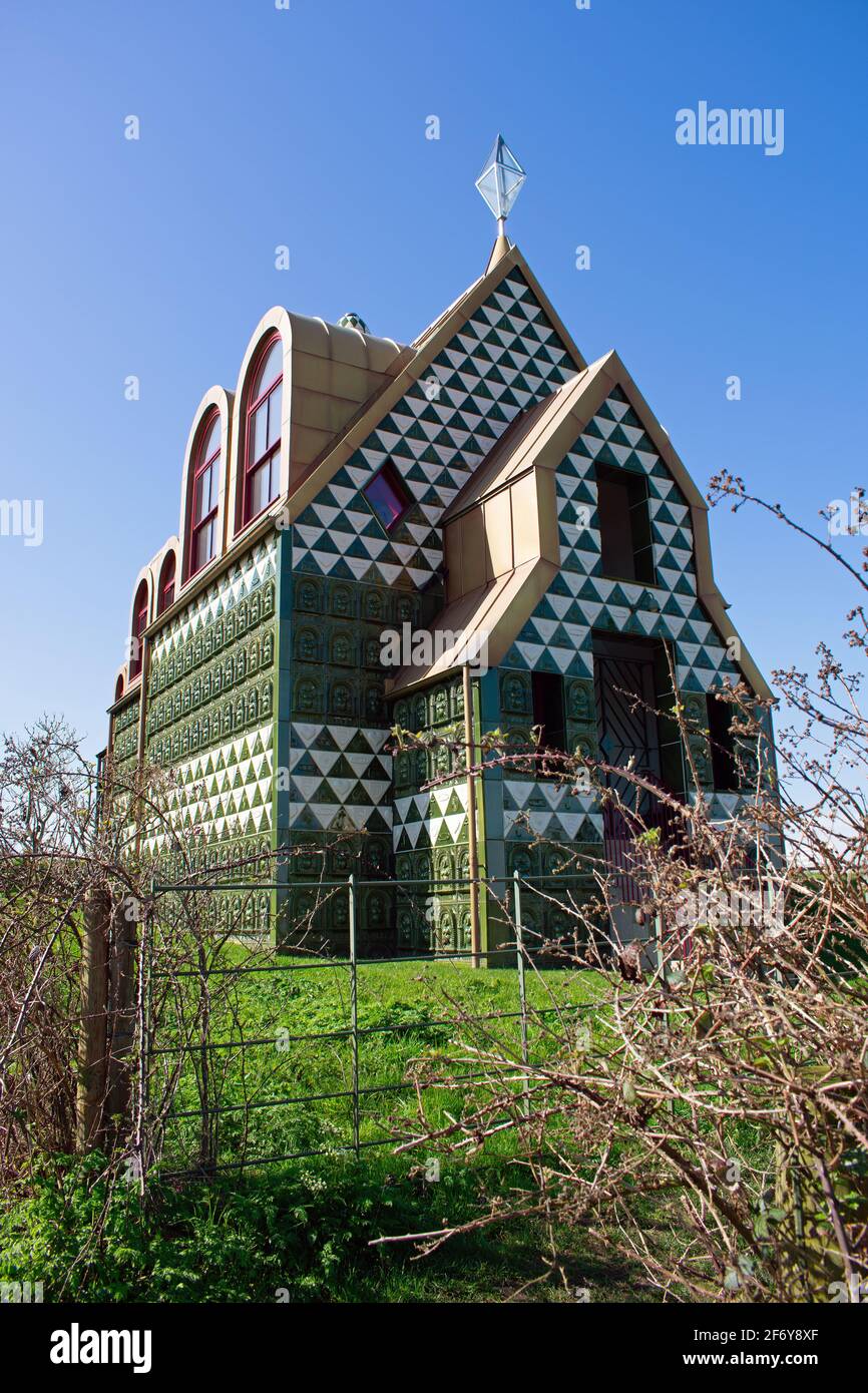 A House For Essex by Grayson Perry in Wrabness, Essex, UK.  A green and white tiled holiday rental with a Gold coloured roof. Stock Photo