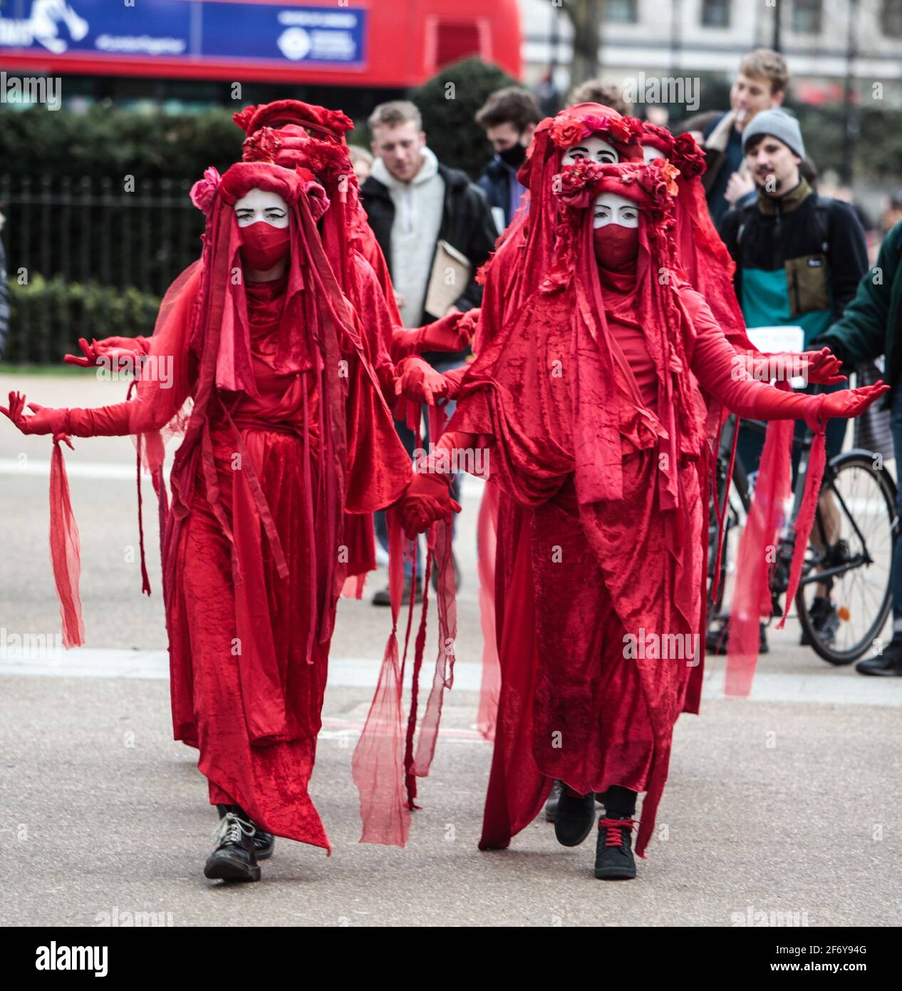 London UK 03 April 2021 Red brigades from Extinction Rebellion  drape themselves in robes  resembling blood  at the Kill The Bill prophets in Hyde Park  today,Paul Quezada-Neiman/Alamy live News Stock Photo