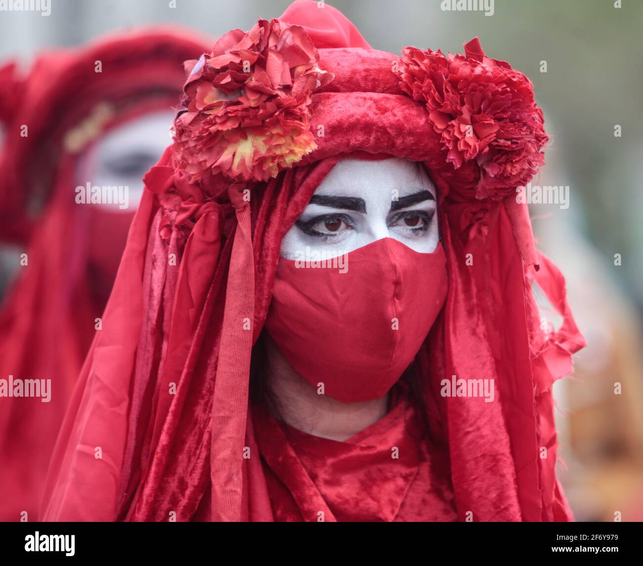 London UK 03 April 2021 Red brigades from Extinction Rebellion  drape themselves in robes  resembling blood  at the Kill The Bill prophets in Hyde Park  today,Paul Quezada-Neiman/Alamy live News Stock Photo