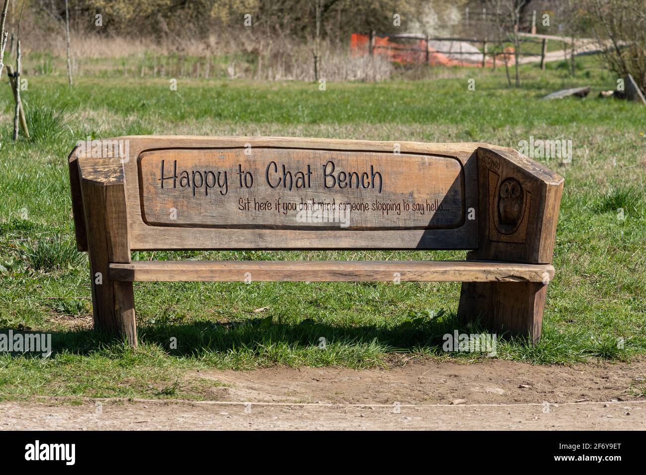 Happy to chat bench in a country park in Hampshire, UK, to help with feelings of social isolation or loneliness. Well-being concept Stock Photo