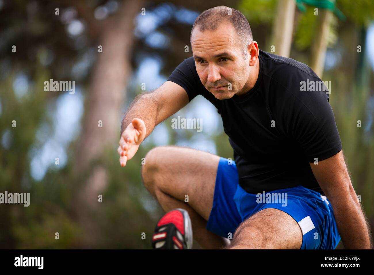 Mature man exercise in a city park Stock Photo