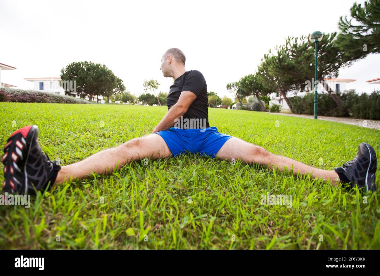 Mature man exercise in a city park Stock Photo