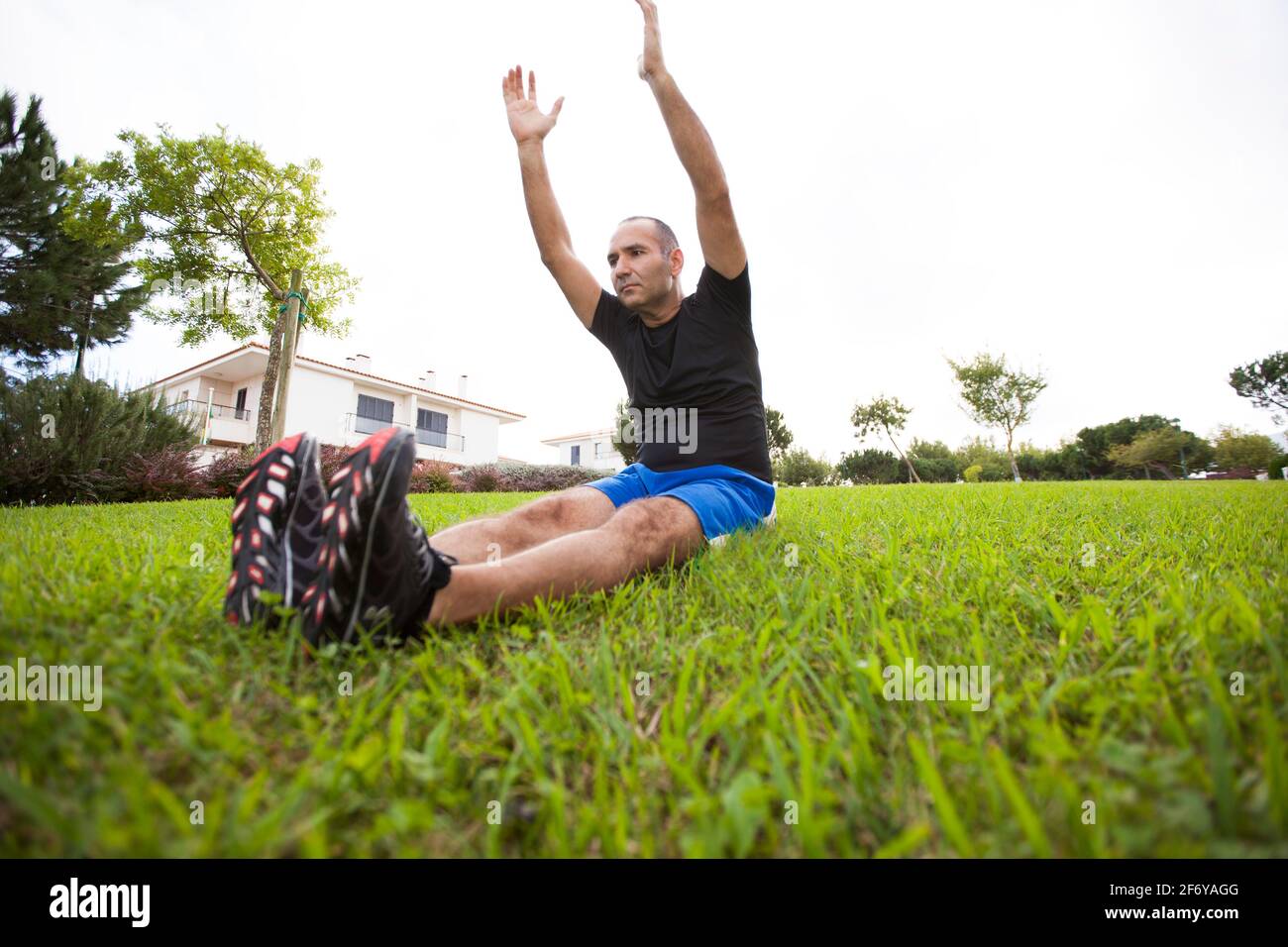 Mature man exercise in a city park Stock Photo