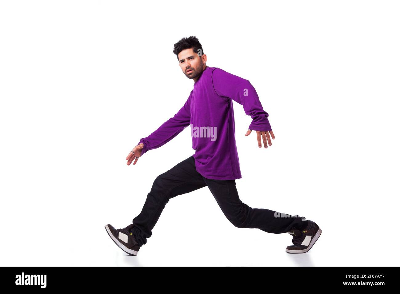 hip hop dancer performing move isolated over white background Stock Photo