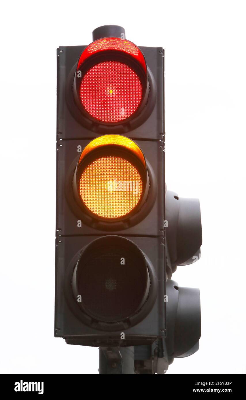 Traffic light changing from red to amber, UK Stock Photo