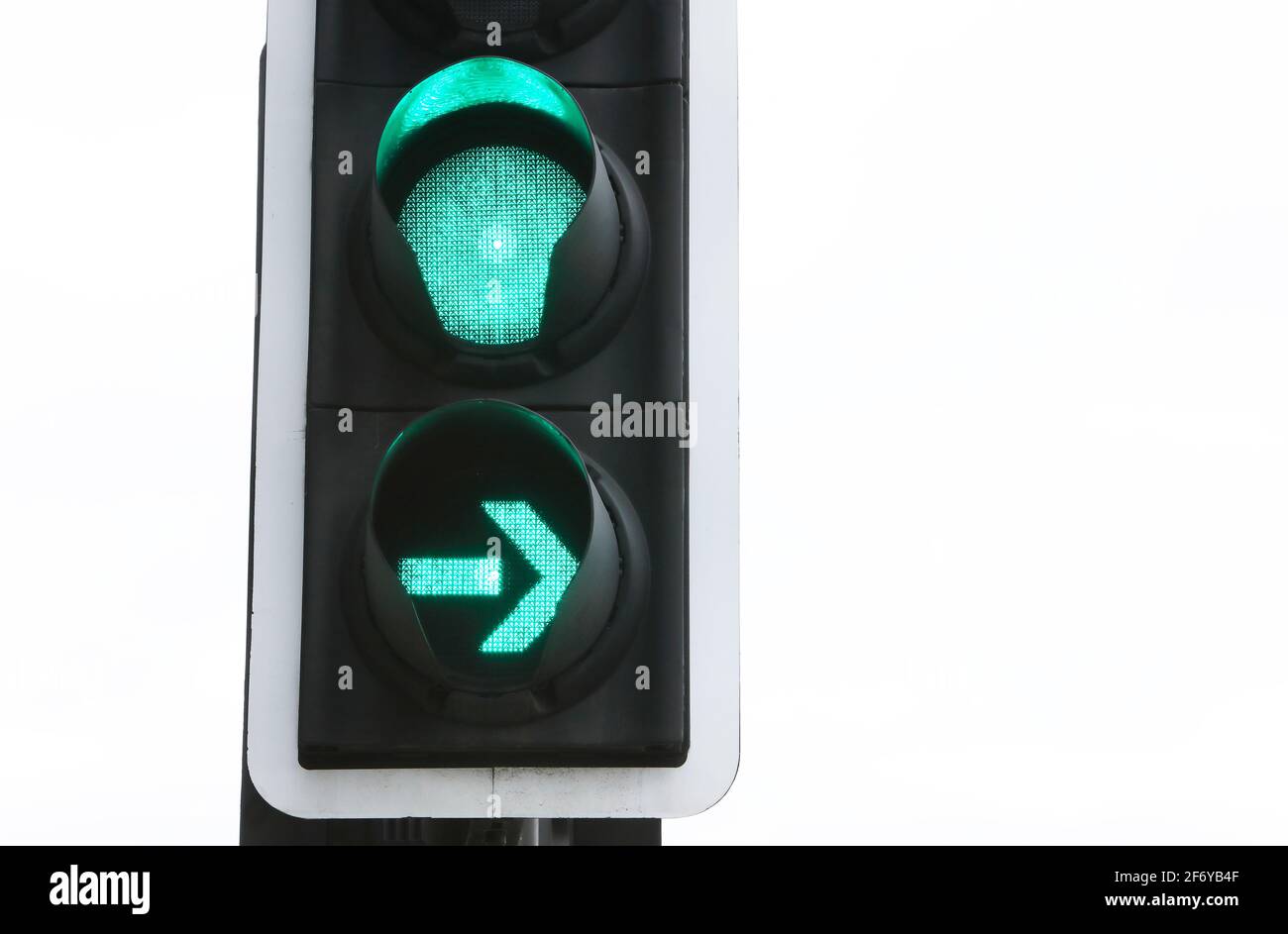 Traffic light on green with green filter, UK Stock Photo - Alamy