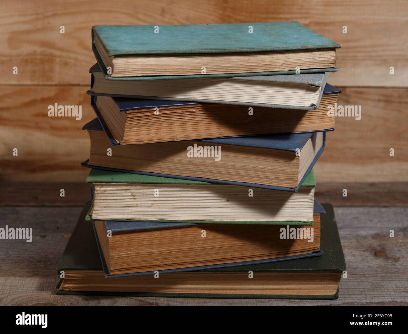 Old shabby books on brown backgrounds from wooden boards. Stock Photo