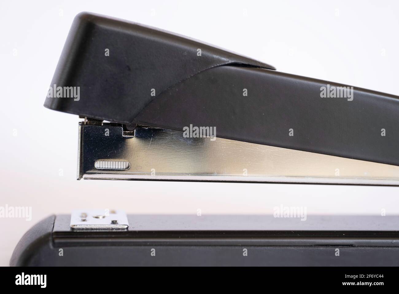 Side view of a black stapler on white background Stock Photo