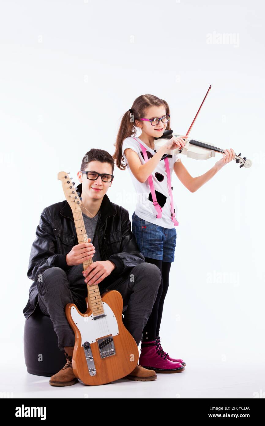 Brother and sisters who love to play music Stock Photo