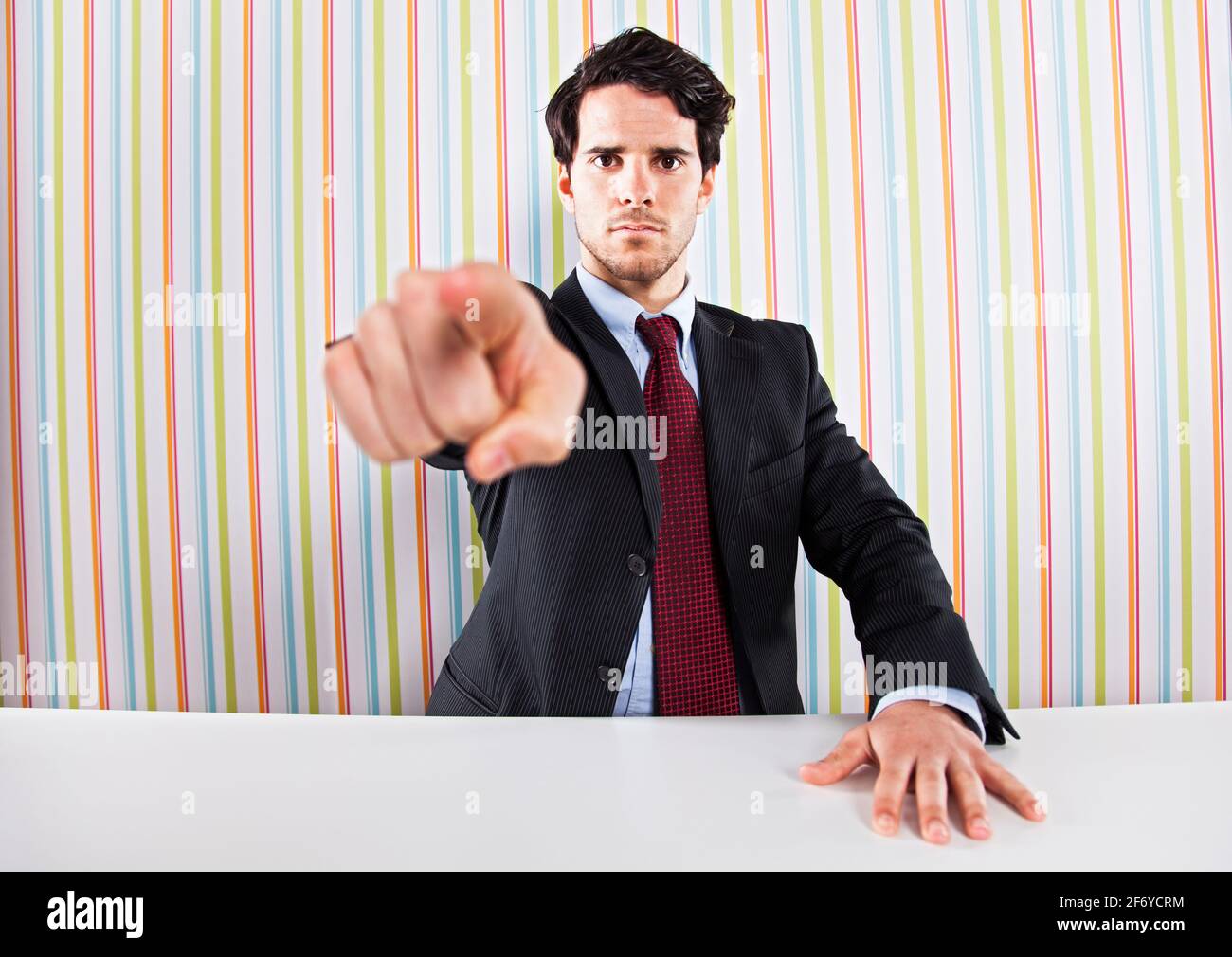 Anger businessman pointing to you Stock Photo